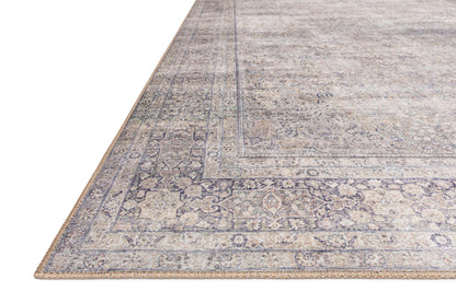 Dressed in shimmering silver and deep charcoal hues, the Wynter WYN-03 Silver / Charcoal Area Rug is a power-loomed 100% polyester area rug that completes any room