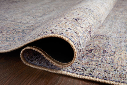 Dressed in shimmering silver and deep charcoal hues, the Wynter WYN-03 Silver / Charcoal Area Rug is a power-loomed 100% polyester area rug that completes any room