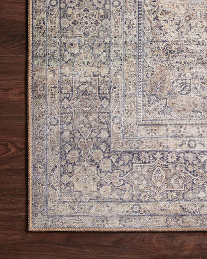 Dressed in shimmering silver and deep charcoal hues, the Wynter WYN-03 Silver / Charcoal Area Rug is a power-loomed 100% polyester area rug that completes any room