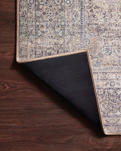 Dressed in shimmering silver and deep charcoal hues, the Wynter WYN-03 Silver / Charcoal Area Rug is a power-loomed 100% polyester area rug that completes any room
