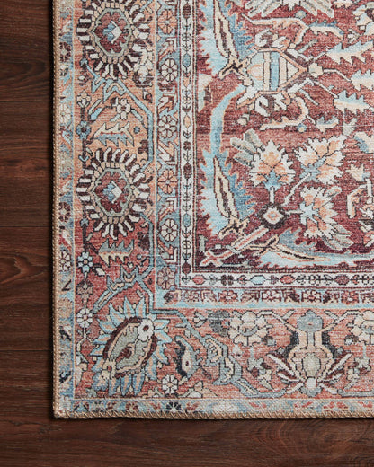 A power-loomed 100% polyester area rug in tomato and vibrant teal tones, the Wynter WYN-05 Tomato / Teal Area Rug grounds your room beautifully
