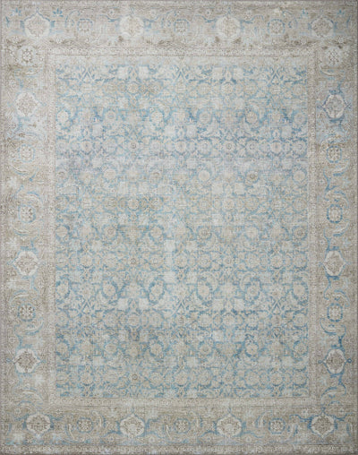A power-loomed 100% polyester area rug in serene ocean and shimmering silver tones, the Wynter WYN-10 Ocean / Silver Area Rug anchors any room
