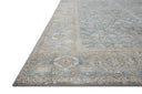 A power-loomed 100% polyester area rug in serene ocean and shimmering silver tones, the Wynter WYN-10 Ocean / Silver Area Rug anchors any room