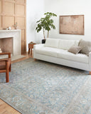 A power-loomed 100% polyester area rug in serene ocean and shimmering silver tones, the Wynter WYN-10 Ocean / Silver Area Rug anchors any room