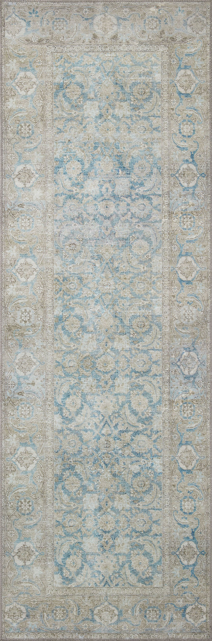 A power-loomed 100% polyester area rug in serene ocean and shimmering silver tones, the Wynter WYN-10 Ocean / Silver Area Rug anchors any room