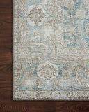 A power-loomed 100% polyester area rug in serene ocean and shimmering silver tones, the Wynter WYN-10 Ocean / Silver Area Rug anchors any room