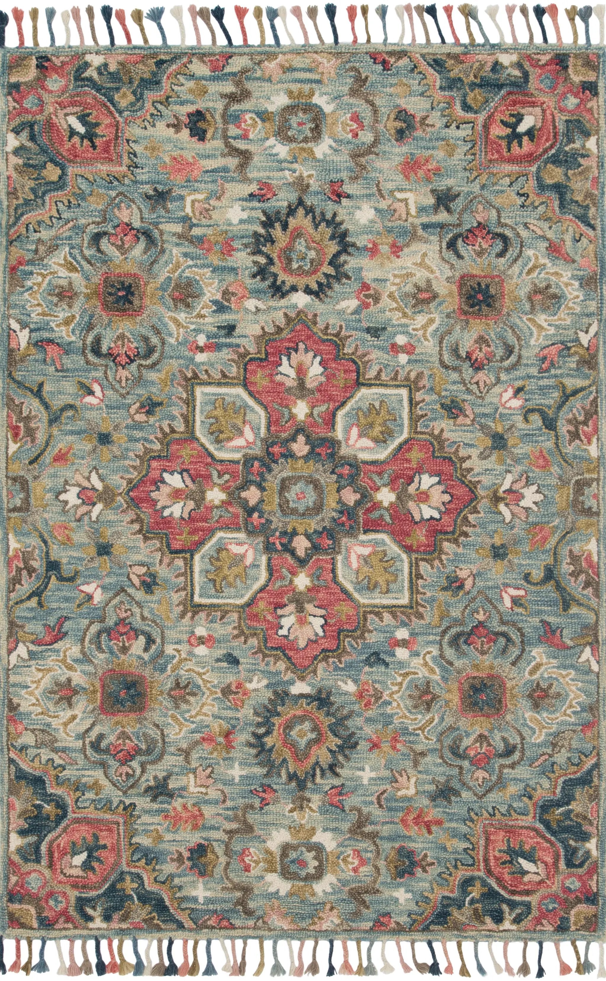 The Zharah ZR-13 Light Blue / Multi Area Rug brings light blue and vibrant multi-toned character to your home in a hooked 100% wool area rug