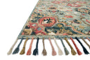 The Zharah ZR-13 Light Blue / Multi Area Rug brings light blue and vibrant multi-toned character to your home in a hooked 100% wool area rug