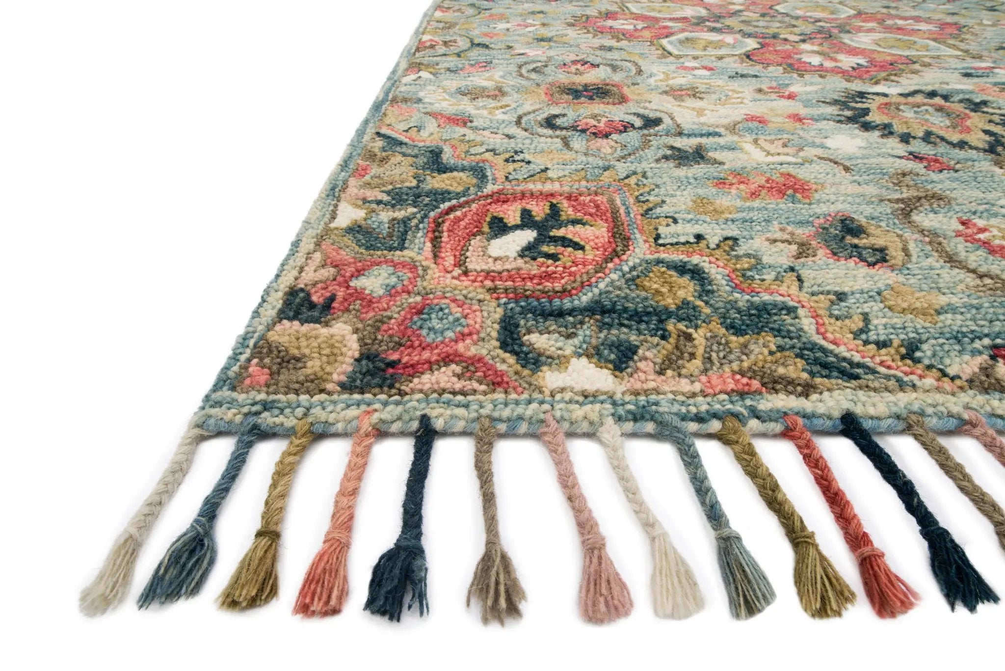 The Zharah ZR-13 Light Blue / Multi Area Rug brings light blue and vibrant multi-toned character to your home in a hooked 100% wool area rug