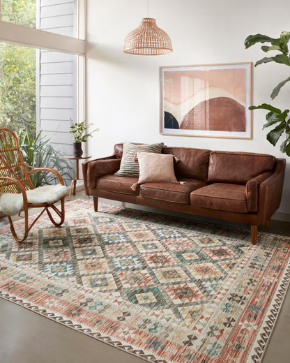 Dressed in refined ivory and vibrant multi-toned hues, the Zion ZIO-04 Ivory / Multi Area Rug is a power-loomed 100% polyester area rug that completes any room
