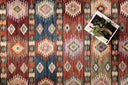 A power-loomed 100% polyester area rug in lively fiesta and vibrant multi-toned tones, the Zion ZIO-06 Fiesta / Multi Area Rug grounds your room beautifully