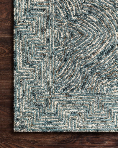 Featuring casual denim hues and contemporary and linear detail, the Ziva ZV-04 Denim Area Rug is a hand-tufted 100% wool area rug for any room