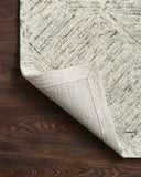 A hand-tufted 100% wool area rug with contemporary and linear flair in breezy sky-blue tones, the Ziva ZV-05 Sky Area Rug anchors any room