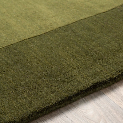 Livabliss Mystique M-315 Olive wool area rug featuring a dynamic high and low pile layout with traditional hand-loomed texture and structural resilience.