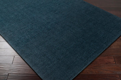 Livabliss Mystique M-340 Dark blue hand-loomed wool area rug with high-low pile texture on two-tone wood flooring.