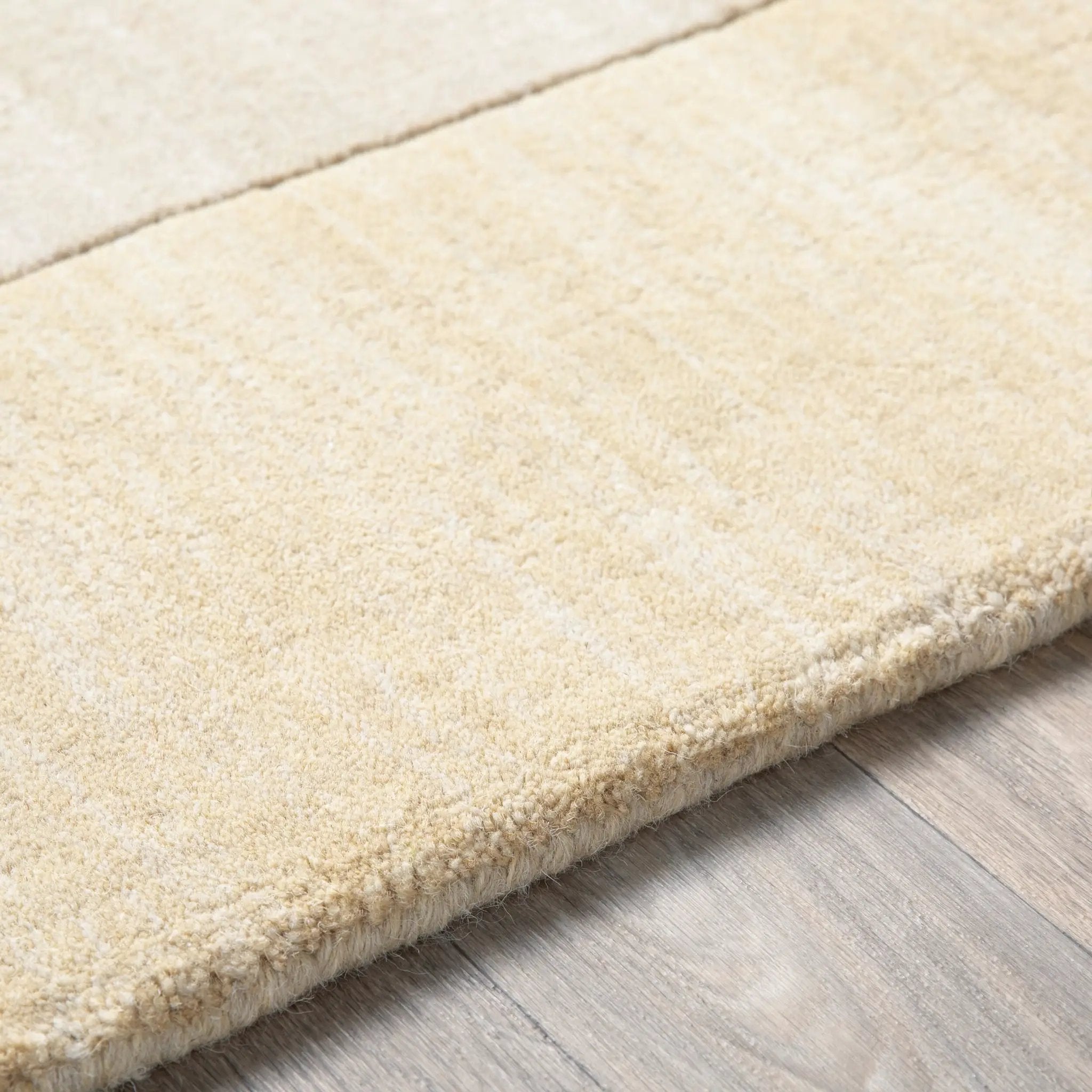 Livabliss Mystique M-344 Beige hand-loomed wool area rug with dynamic high-low pile texture and minimalist design for modern interiors.