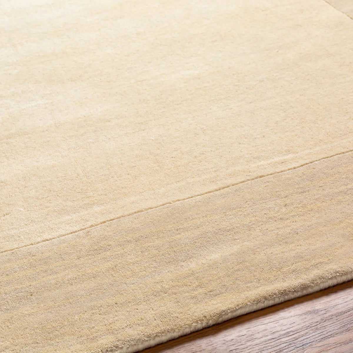 Livabliss Mystique M-348 Cream hand-loomed wool area rug featuring a textured high/low pile profile and structured border for contemporary interiors.