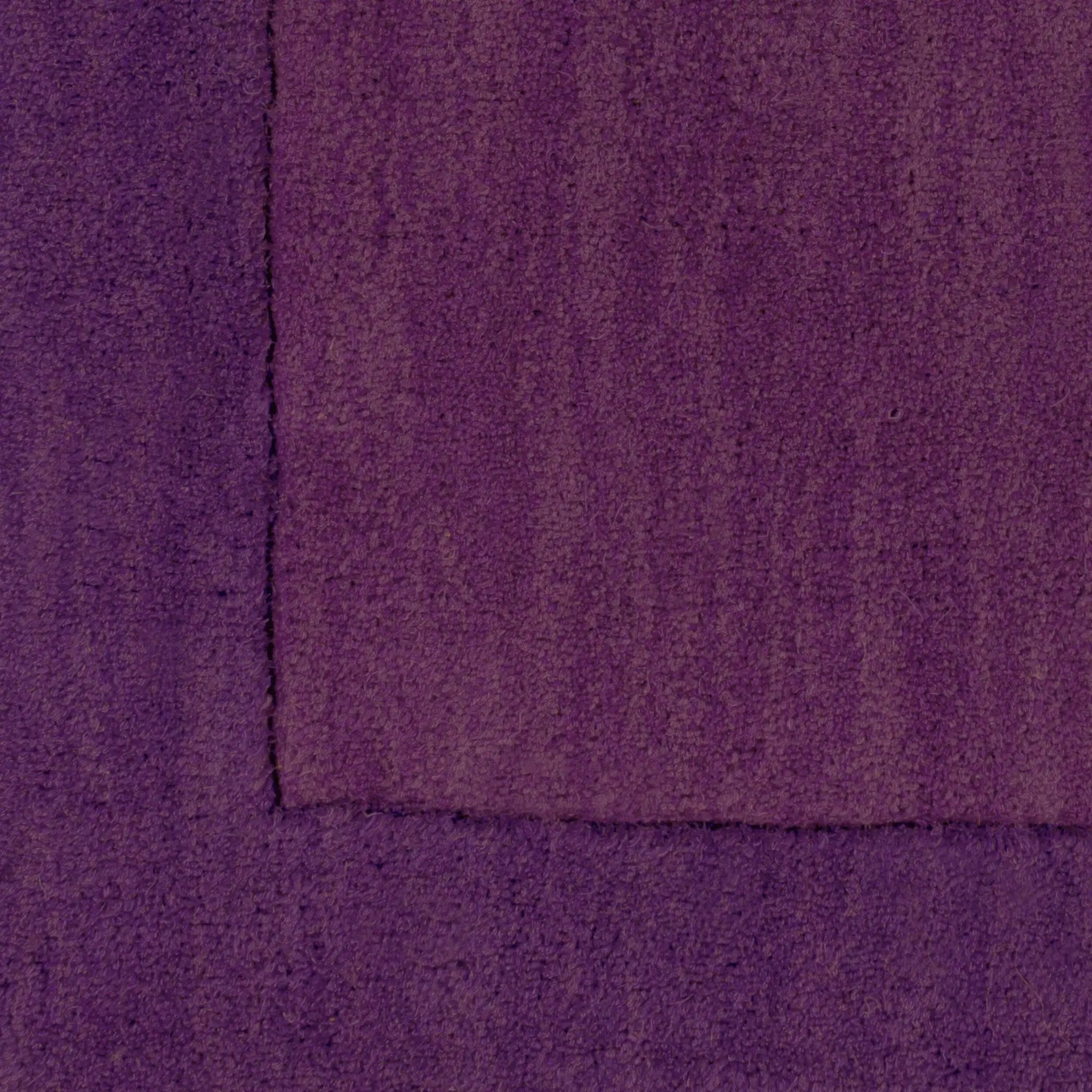 Close-up of Livabliss Mystique M-349 purple hand-loomed wool area rug texture showing artisan details from India.