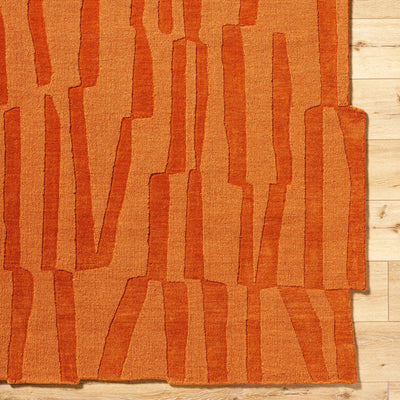 Livabliss Mystique M-5488 Burnt sienna hand-loomed wool area rug featuring abstract vertical stripes and artisan texture on light wood flooring.