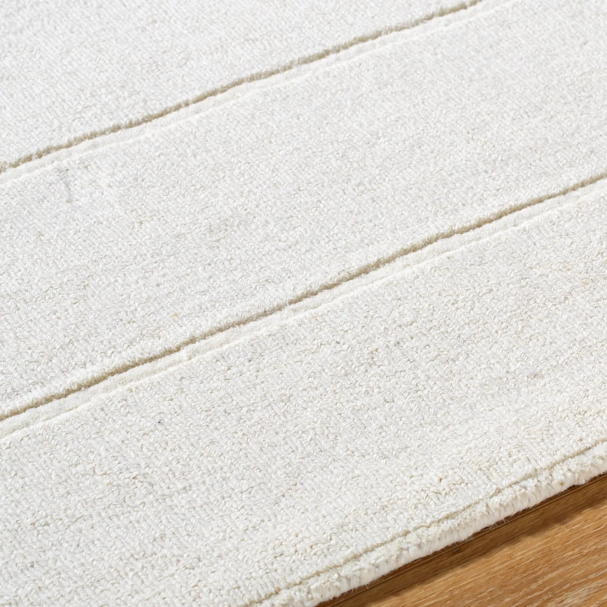 Hand-loomed Livabliss Mystique M-5492 ivory wool area rug with refined striped texture and balanced medium pile, crafted in India for dining rooms, living rooms and bedrooms.