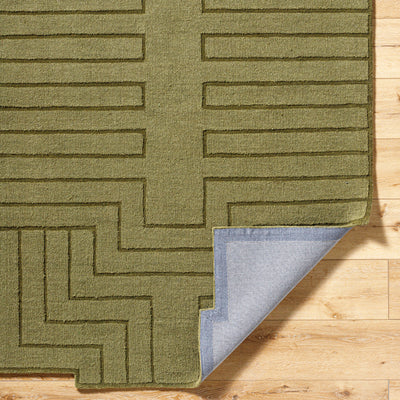 Livabliss Mystique M-5497 Olive green hand-loomed wool area rug with geometric raised pattern and grey backing on hardwood floor.