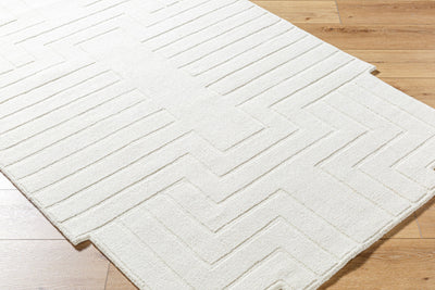 Livabliss Mystique M-5498 Ivory hand-loomed wool area rug featuring a modern geometric chevron pattern and medium pile on hardwood flooring.