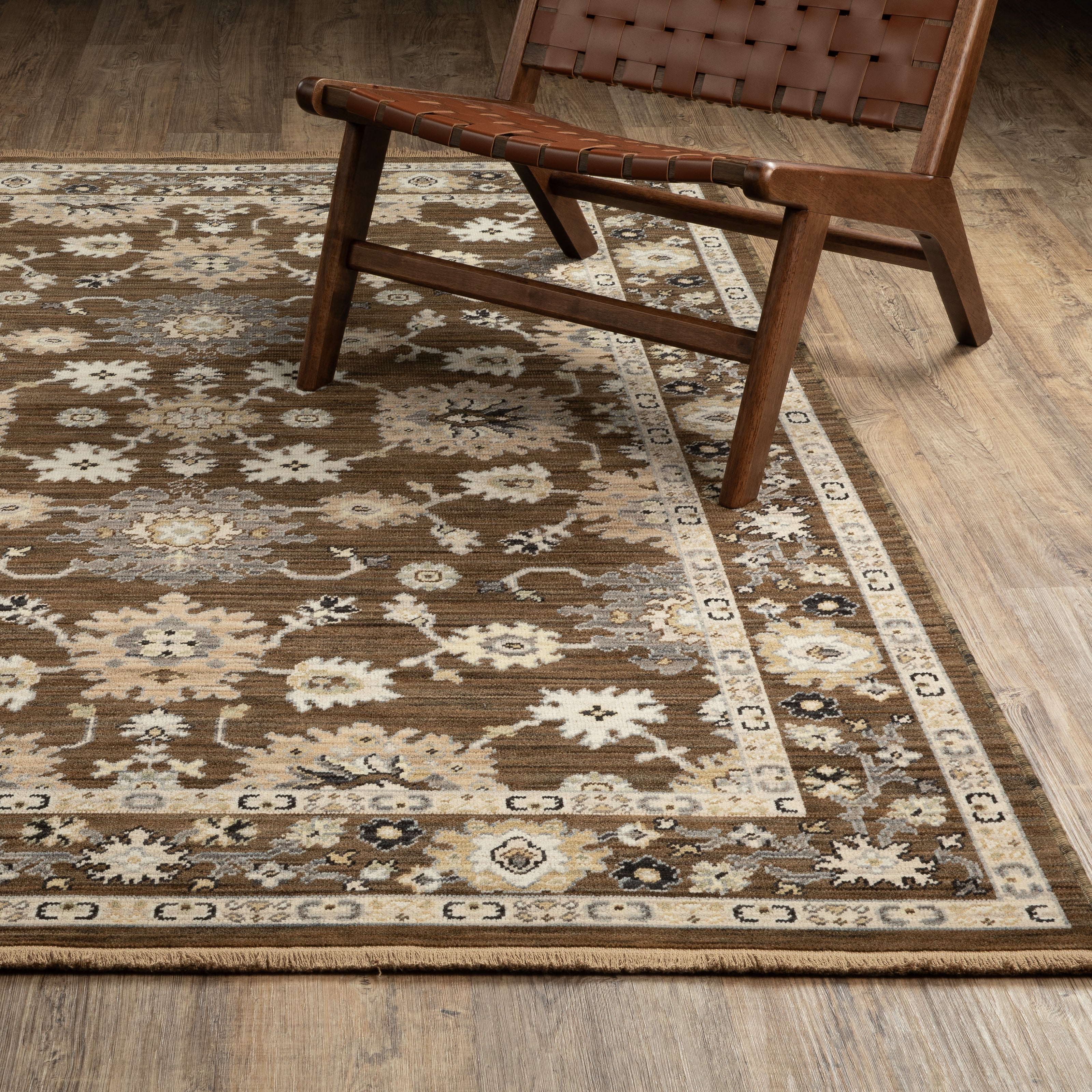 Acacia ACA01 Brown/Tan vintage-inspired area rug with rich brown and tan colors, classic pattern detail, wool nylon blend, and fringe.