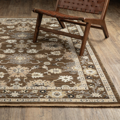 Acacia ACA01 Brown/Tan vintage-inspired area rug with rich brown and tan colors, classic pattern detail, wool nylon blend, and fringe.