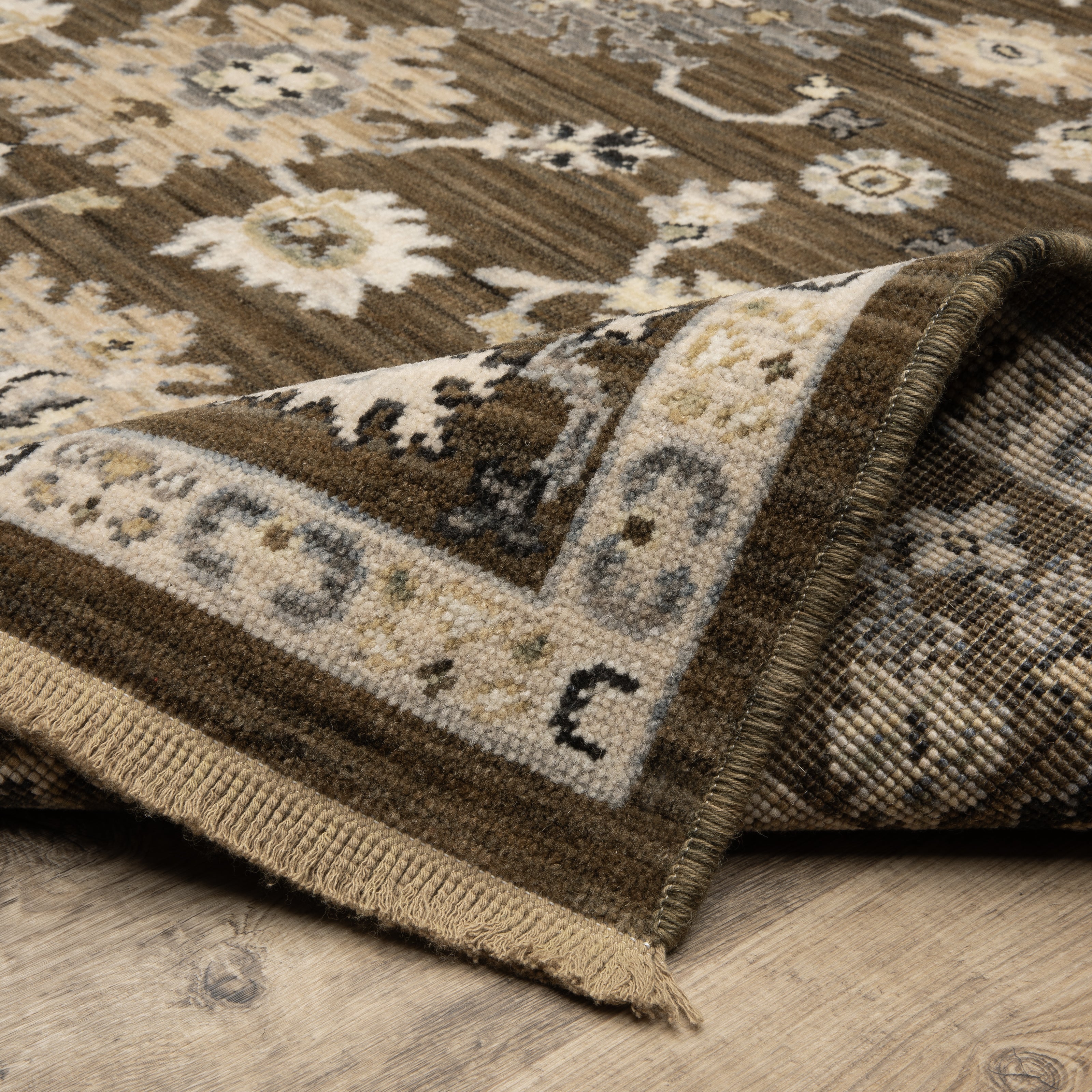 Acacia ACA01 Brown/Tan vintage-inspired area rug with rich brown and tan colors, classic pattern detail, wool nylon blend, and fringe.