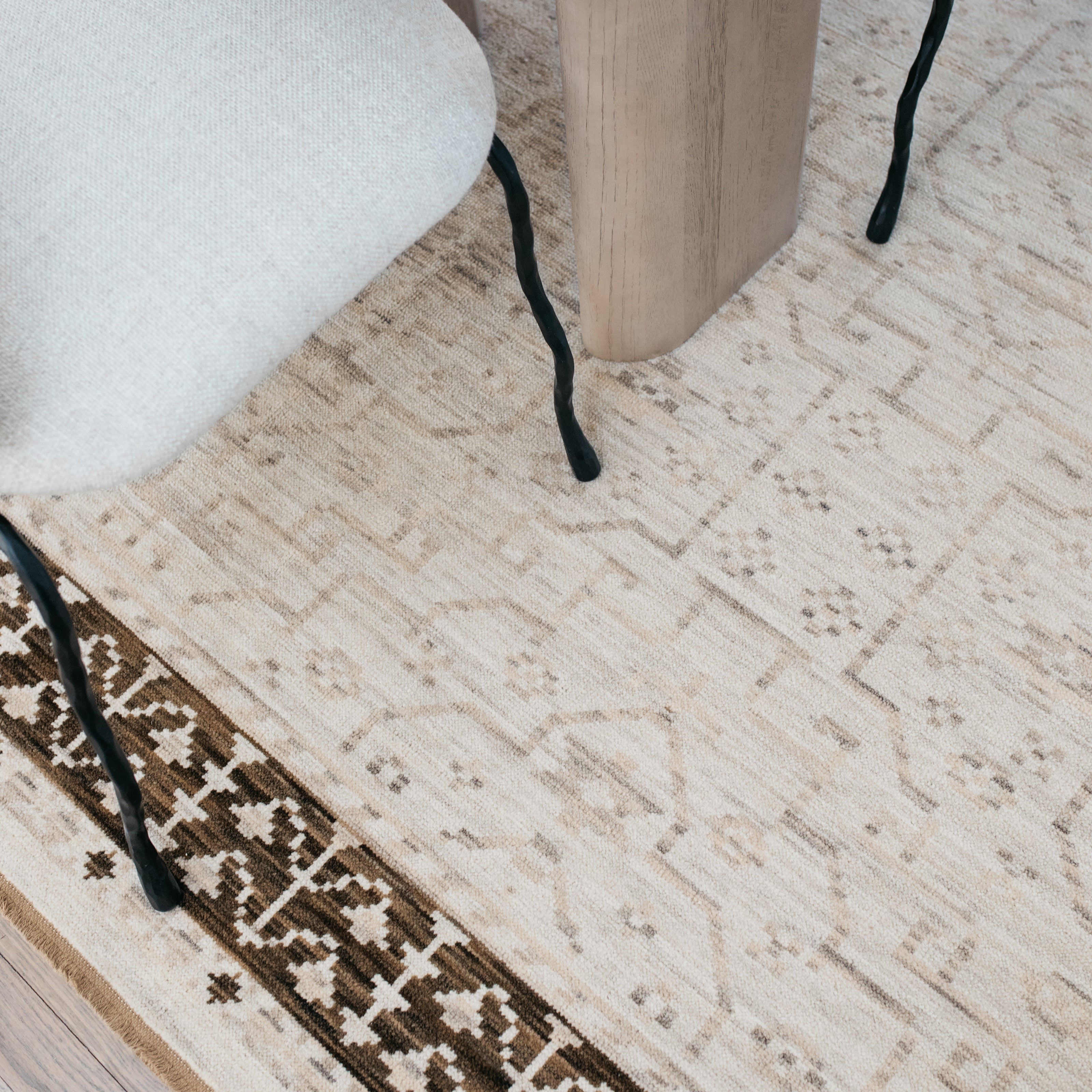 Acacia ACA02 Beige/Brown neutral traditional area rug with layered beige and brown tones, muted accent colors, and cotton fringe.