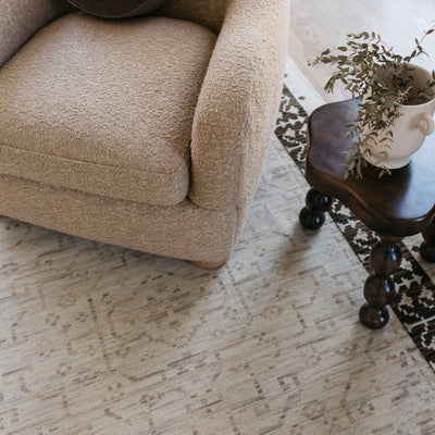 Acacia ACA02 Beige/Brown neutral traditional area rug with layered beige and brown tones, muted accent colors, and cotton fringe.