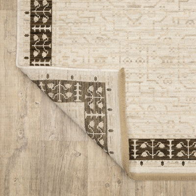 Acacia ACA02 Beige/Brown neutral traditional area rug with layered beige and brown tones, muted accent colors, and cotton fringe.