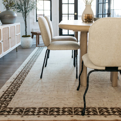 Acacia ACA02 Beige/Brown neutral traditional area rug with layered beige and brown tones, muted accent colors, and cotton fringe.