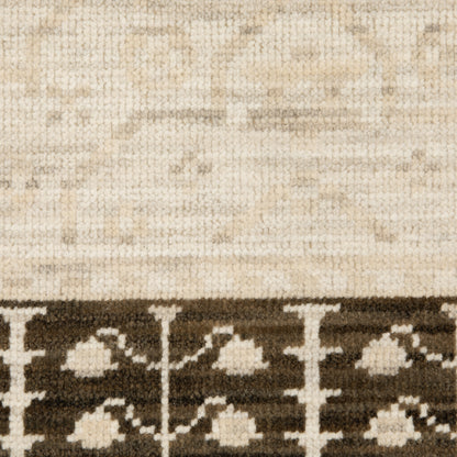 Acacia ACA02 Beige/Brown neutral traditional area rug with layered beige and brown tones, muted accent colors, and cotton fringe.