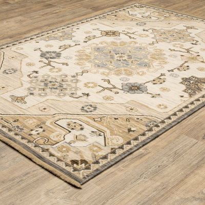 Acacia ACA03 Tan/Grey traditional area rug with earthy tan, grey, brown, gold, blue, clay, and green tones and cotton fringe.