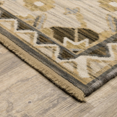 Acacia ACA03 Tan/Grey traditional area rug with earthy tan, grey, brown, gold, blue, clay, and green tones and cotton fringe.