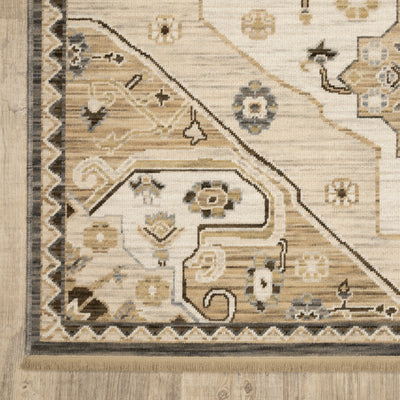 Acacia ACA03 Tan/Grey traditional area rug with earthy tan, grey, brown, gold, blue, clay, and green tones and cotton fringe.