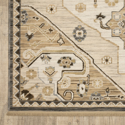 Acacia ACA03 Tan/Grey traditional area rug with earthy tan, grey, brown, gold, blue, clay, and green tones and cotton fringe.