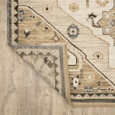 Acacia ACA03 Tan/Grey traditional area rug with earthy tan, grey, brown, gold, blue, clay, and green tones and cotton fringe.