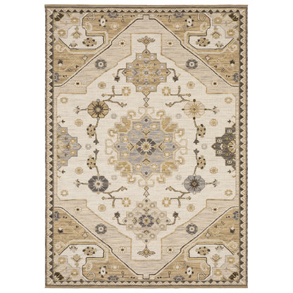Acacia ACA03 Tan/Grey traditional area rug with earthy tan, grey, brown, gold, blue, clay, and green tones and cotton fringe.