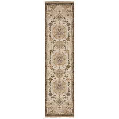 Acacia ACA03 Tan/Grey traditional area rug with earthy tan, grey, brown, gold, blue, clay, and green tones and cotton fringe.