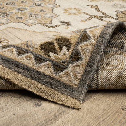 Acacia ACA03 Tan/Grey traditional area rug with earthy tan, grey, brown, gold, blue, clay, and green tones and cotton fringe.