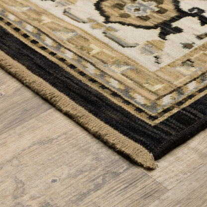 Acacia ACA08 Tan/Black traditional area rug with bold black contrast, warm tan ground, earthy accent colors, and incorporated cotton fringe.