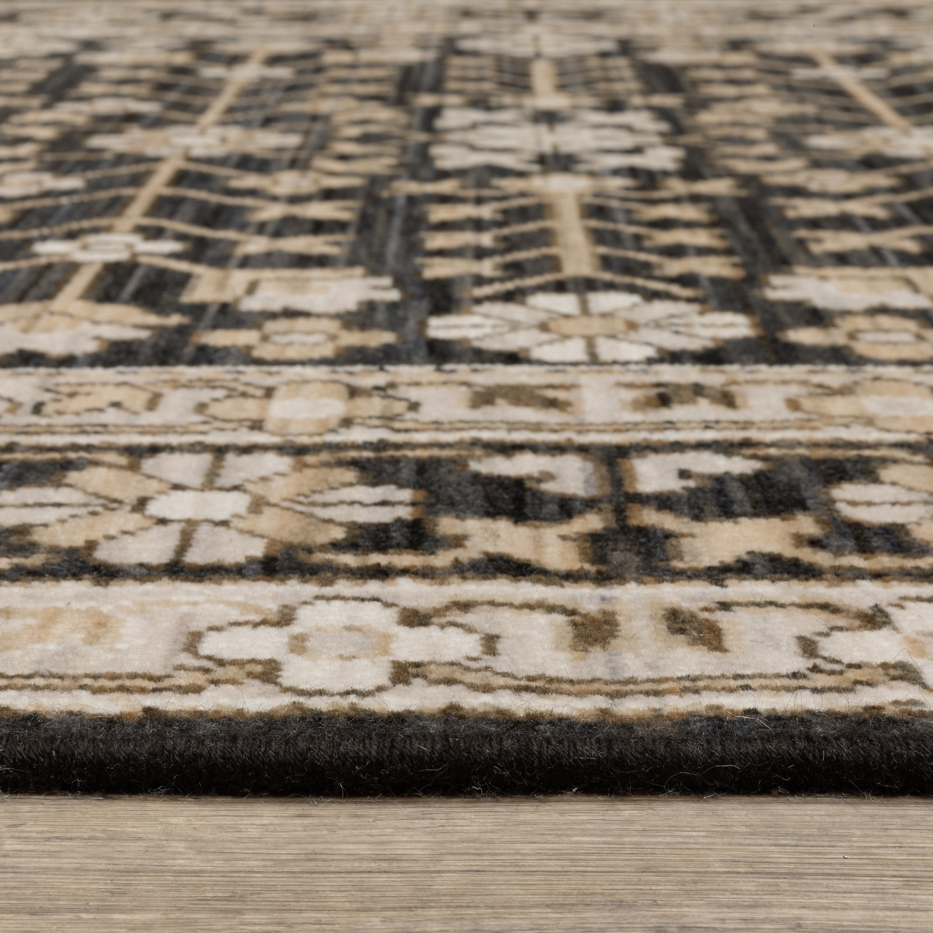 Acacia ACA10 Black/Beige traditional area rug with dramatic black and beige palette, multicolor accents, wool nylon texture, and fringe.