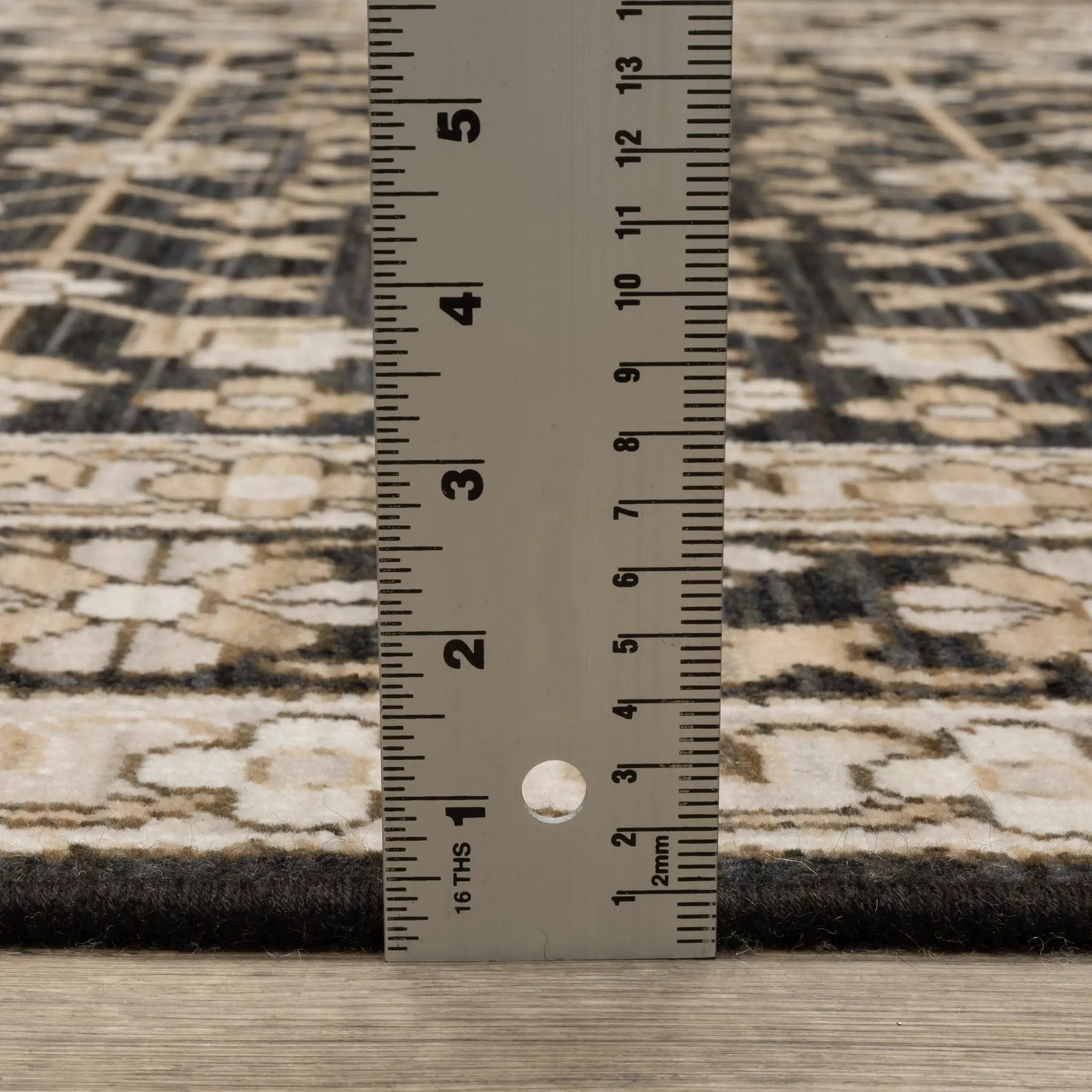 Acacia ACA10 Black/Beige traditional area rug with dramatic black and beige palette, multicolor accents, wool nylon texture, and fringe.