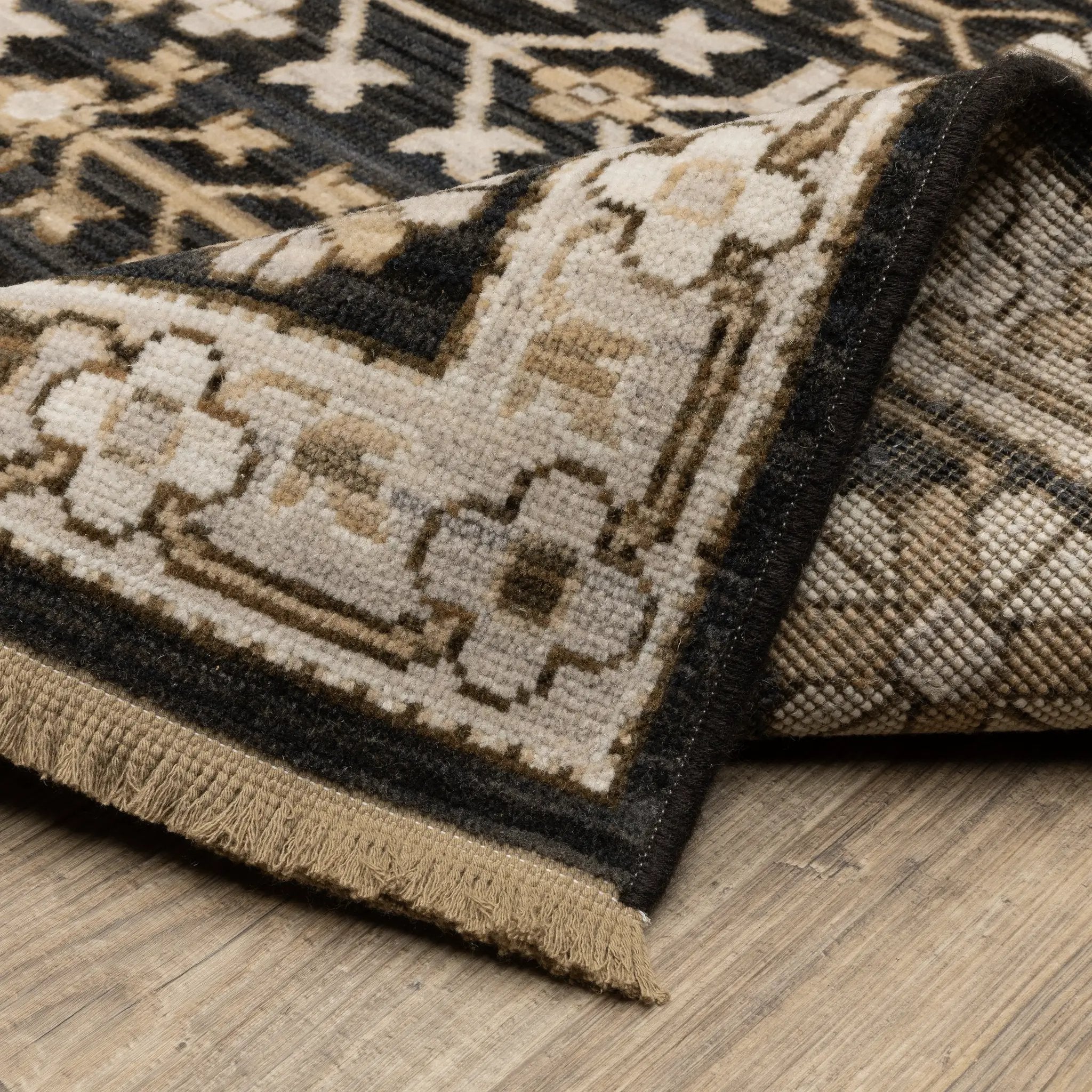 Acacia ACA10 Black/Beige traditional area rug with dramatic black and beige palette, multicolor accents, wool nylon texture, and fringe.