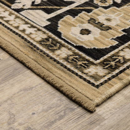 Acacia ACA12 Tan/Charcoal area rug with warm tan ground, charcoal contrast, traditional pattern detail, earthy accents, and cotton fringe.