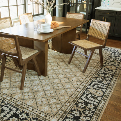 Acacia ACA12 Tan/Charcoal area rug with warm tan ground, charcoal contrast, traditional pattern detail, earthy accents, and cotton fringe.