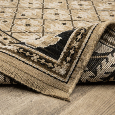 Acacia ACA12 Tan/Charcoal area rug with warm tan ground, charcoal contrast, traditional pattern detail, earthy accents, and cotton fringe.