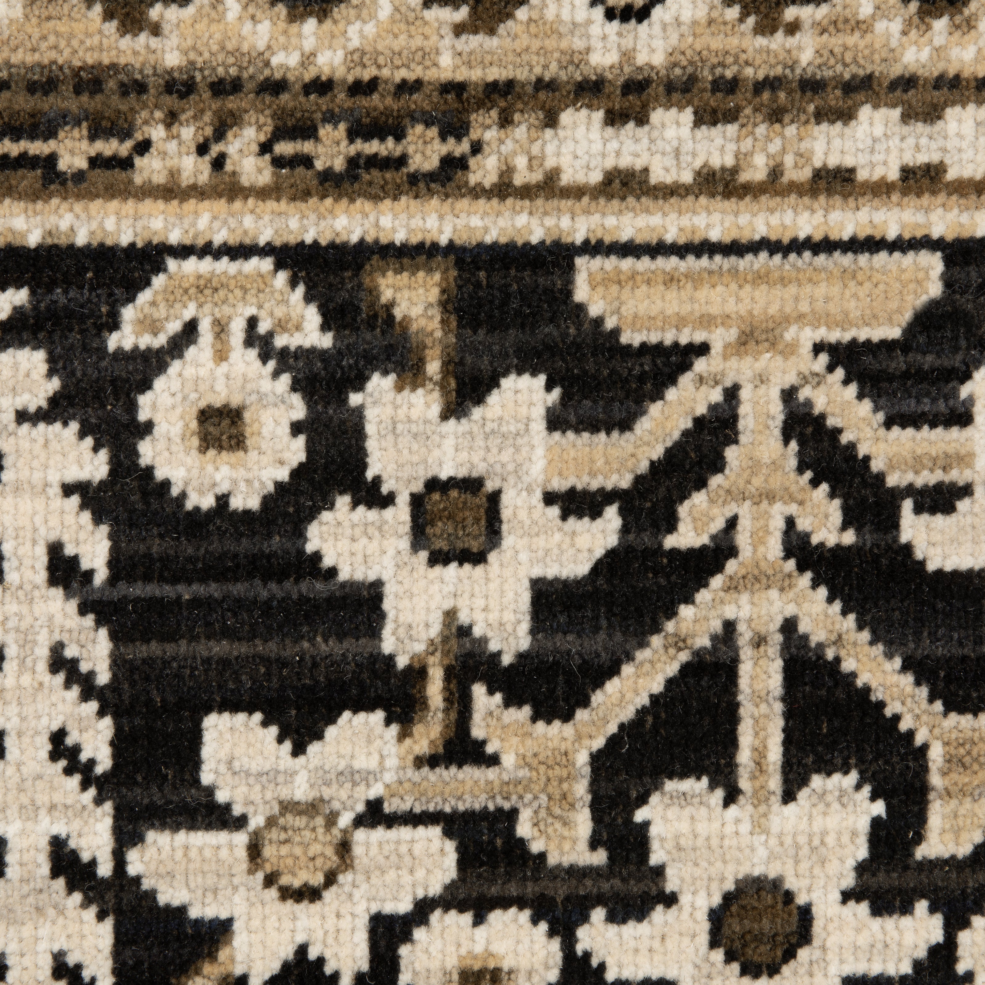 Acacia ACA12 Tan/Charcoal area rug with warm tan ground, charcoal contrast, traditional pattern detail, earthy accents, and cotton fringe.